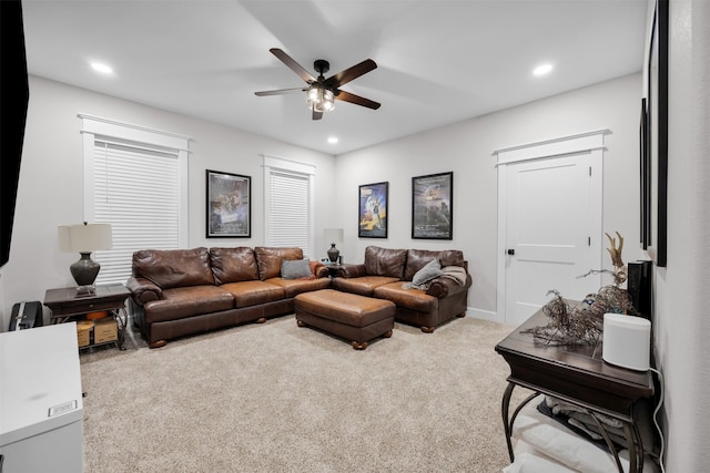 carpeted living room featuring ceiling fan