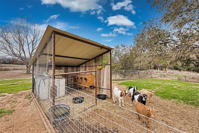 view of outbuilding with a rural view