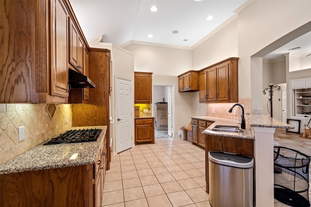 kitchen with white appliances, crown molding, light stone countertops, light tile patterned flooring, and kitchen peninsula