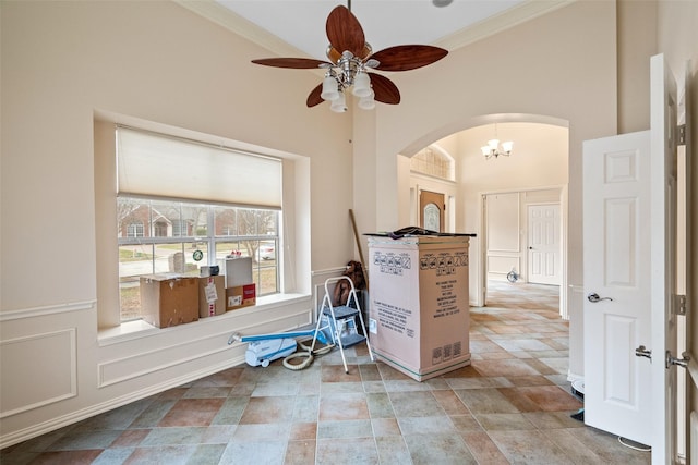 unfurnished room featuring ceiling fan and ornamental molding