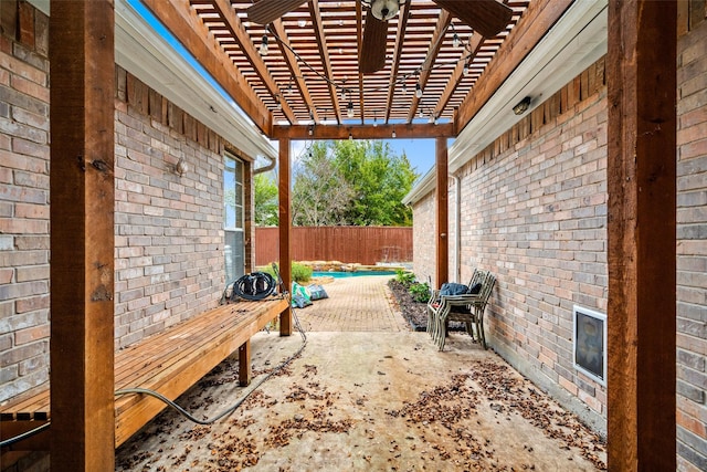 view of pool featuring a storage shed and a patio area