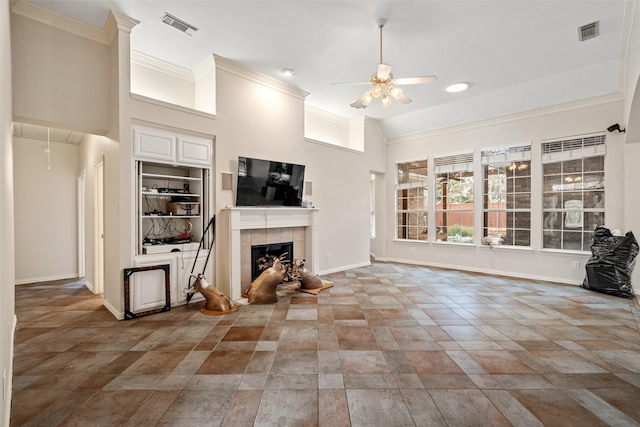 living room with ceiling fan and ornamental molding