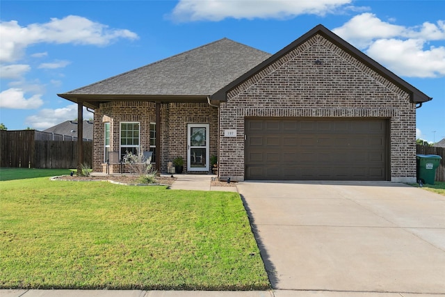 view of front facade featuring a garage and a front lawn