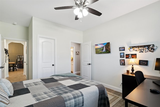 bedroom featuring wood-type flooring and ceiling fan