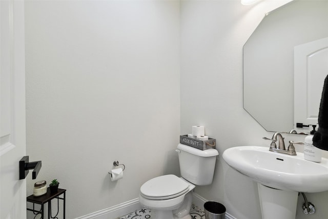 bathroom featuring toilet and sink