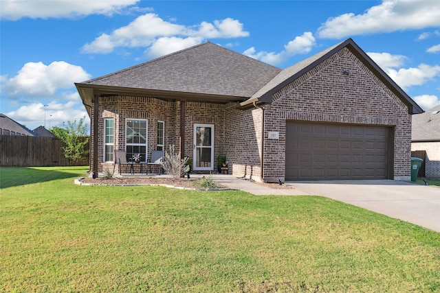 view of front of house with a front lawn and a garage