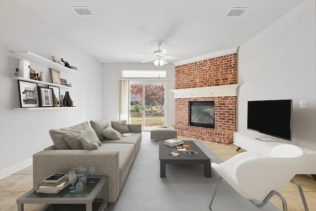 living room featuring ceiling fan, light tile patterned floors, and a fireplace