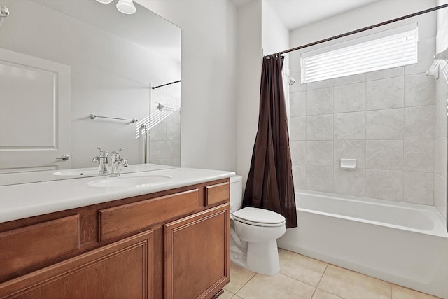 full bathroom featuring tile patterned flooring, vanity, toilet, and shower / bath combo with shower curtain