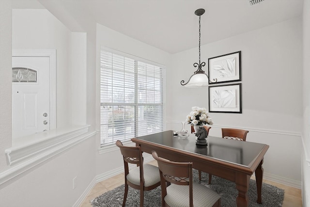 dining room featuring light tile patterned floors and a wealth of natural light