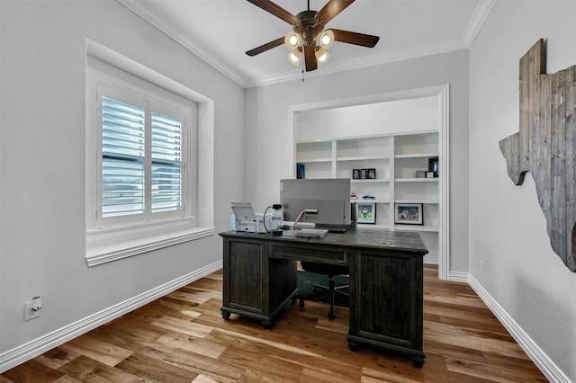 office area with crown molding, wood-type flooring, and ceiling fan