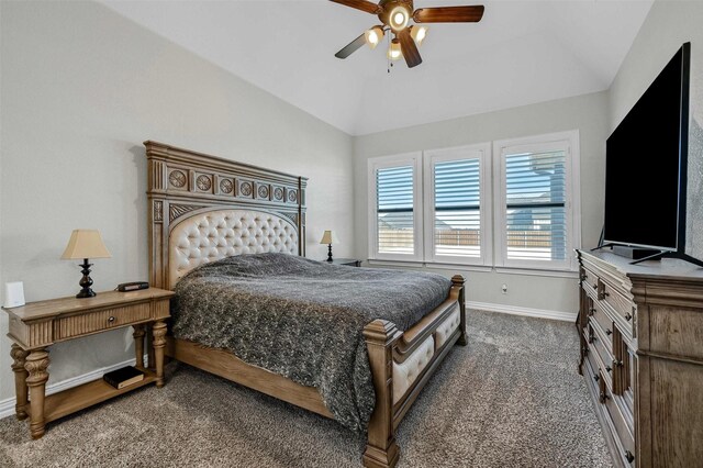 carpeted bedroom with ceiling fan and vaulted ceiling