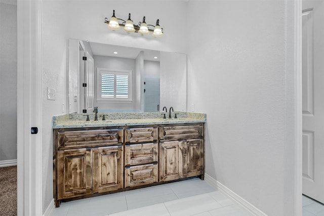 bathroom featuring tile patterned floors and vanity