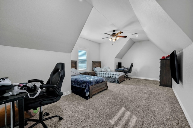 bedroom featuring vaulted ceiling, ceiling fan, carpet floors, and a textured ceiling