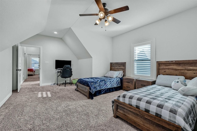 bedroom featuring vaulted ceiling, carpet flooring, and ceiling fan