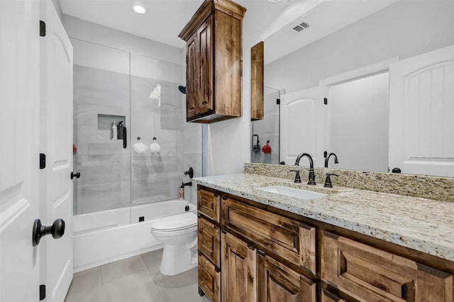 full bathroom featuring tile patterned flooring, vanity, enclosed tub / shower combo, and toilet