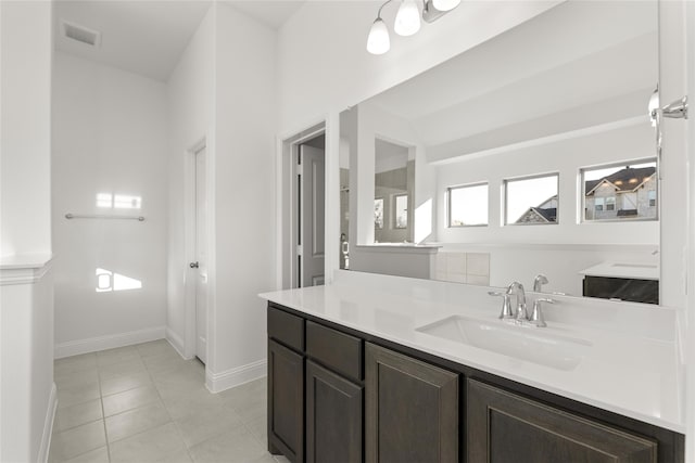 bathroom with vanity and tile patterned floors