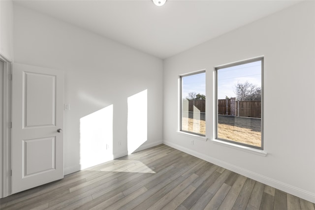 unfurnished room with light hardwood / wood-style floors