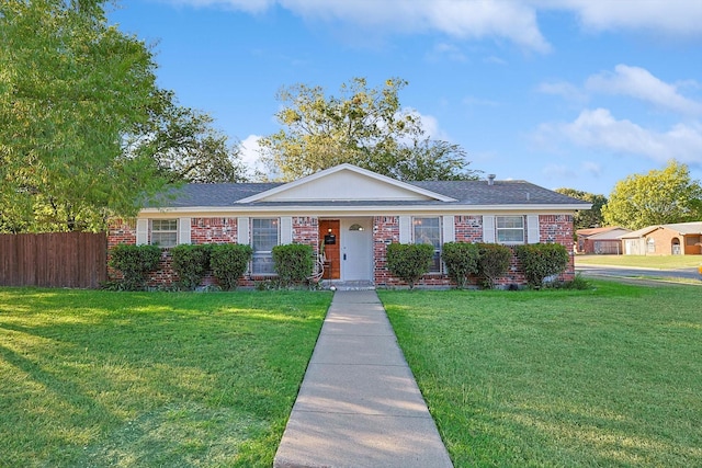 single story home featuring a front lawn