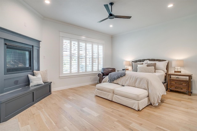 bedroom with light wood-type flooring, ceiling fan, and ornamental molding