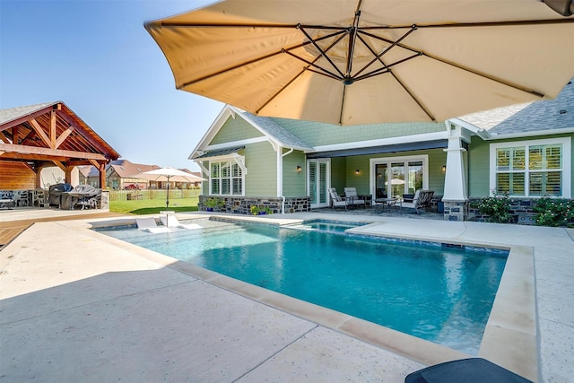 view of swimming pool with a patio area