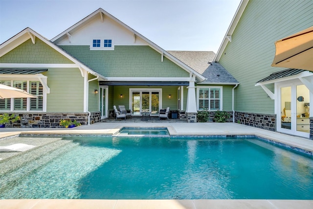 view of pool featuring a patio area, outdoor lounge area, and french doors