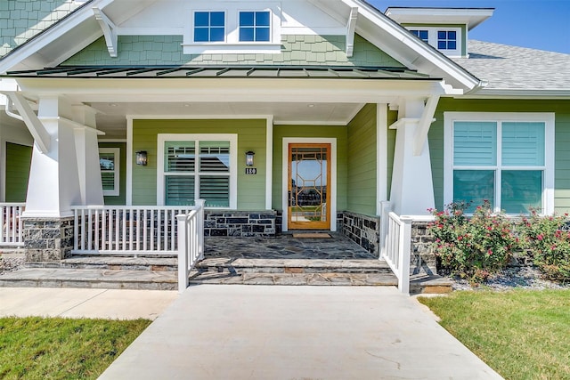 property entrance with covered porch