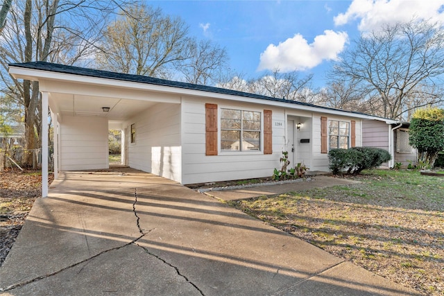 ranch-style home with a carport