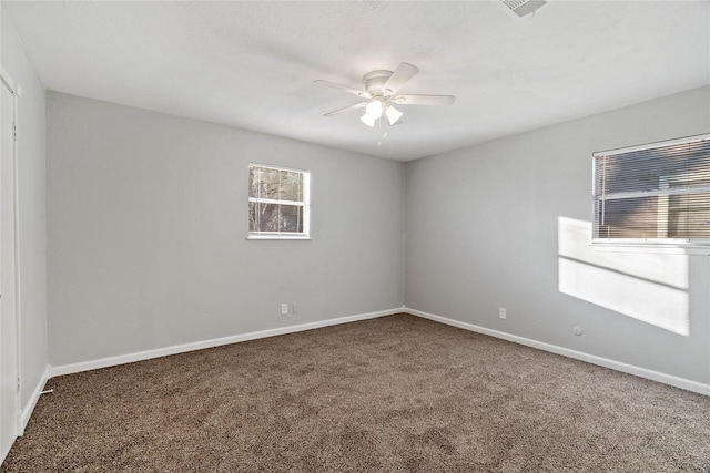 empty room featuring carpet flooring and ceiling fan