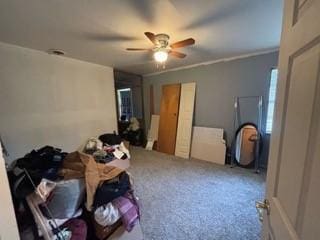 bedroom featuring carpet, ceiling fan, and crown molding