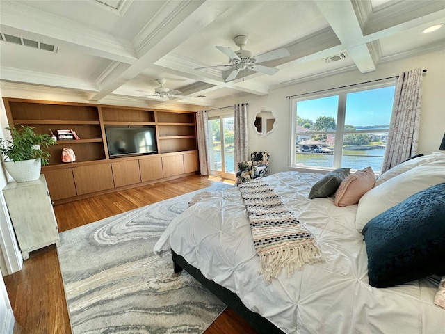 bedroom featuring beamed ceiling, ornamental molding, and coffered ceiling