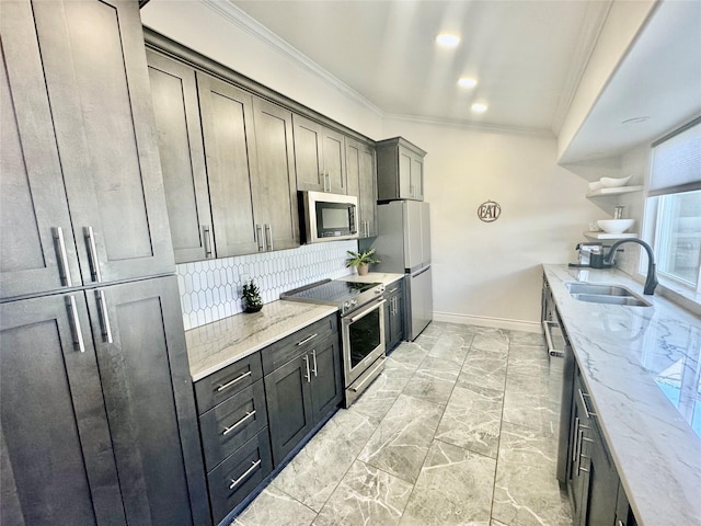 kitchen with sink, light stone counters, crown molding, decorative backsplash, and appliances with stainless steel finishes