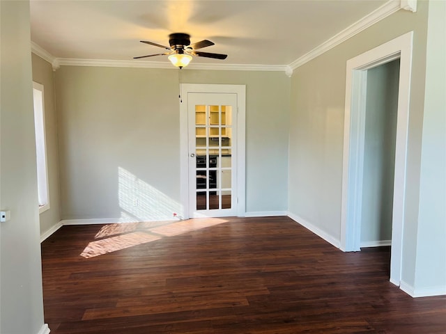 unfurnished room featuring dark hardwood / wood-style flooring, ornamental molding, and ceiling fan