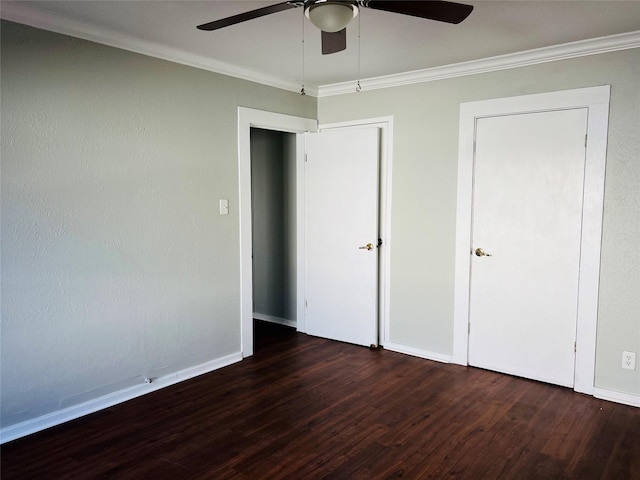 unfurnished bedroom with crown molding, ceiling fan, and dark hardwood / wood-style floors