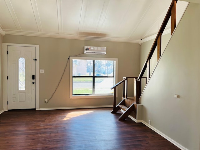 foyer entrance featuring ornamental molding, dark hardwood / wood-style floors, and a wall unit AC