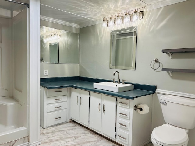 bathroom featuring crown molding, vanity, toilet, and a shower