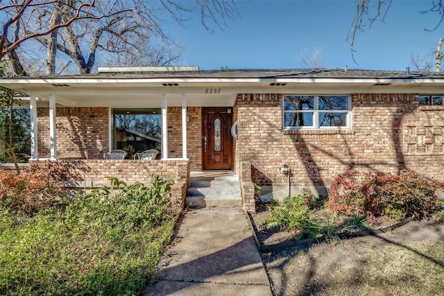 exterior space with brick siding