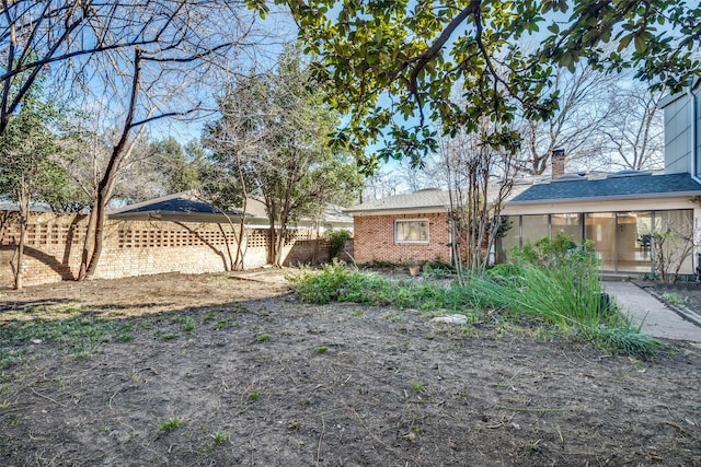 view of yard with a sunroom