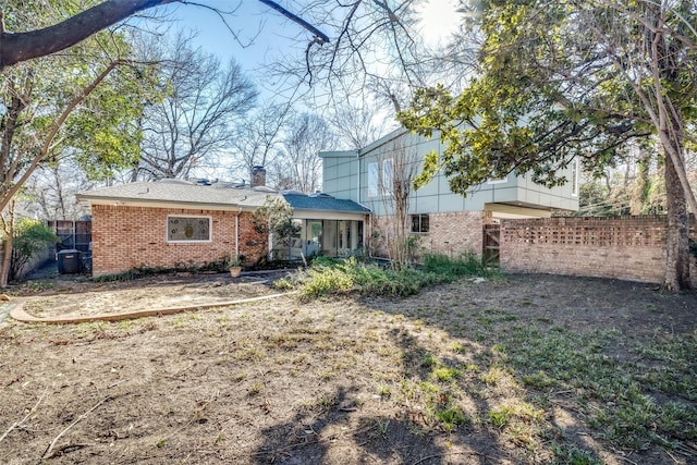 rear view of property featuring cooling unit