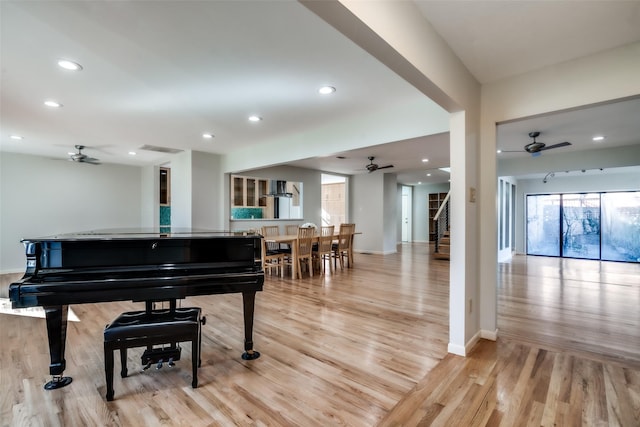 miscellaneous room featuring ceiling fan and light wood-type flooring