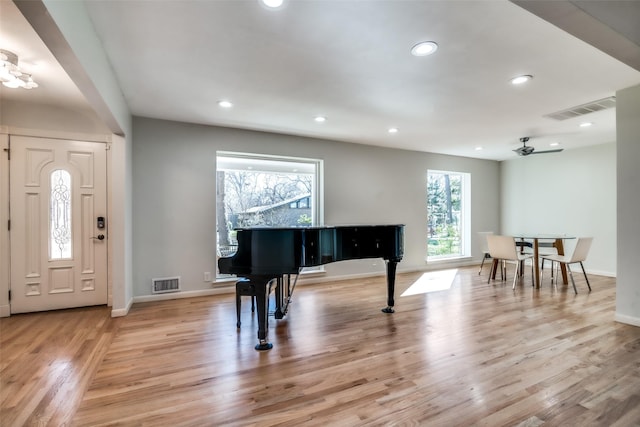 misc room featuring ceiling fan and light hardwood / wood-style floors