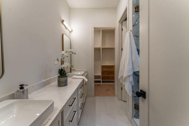 bathroom featuring tile patterned flooring and vanity