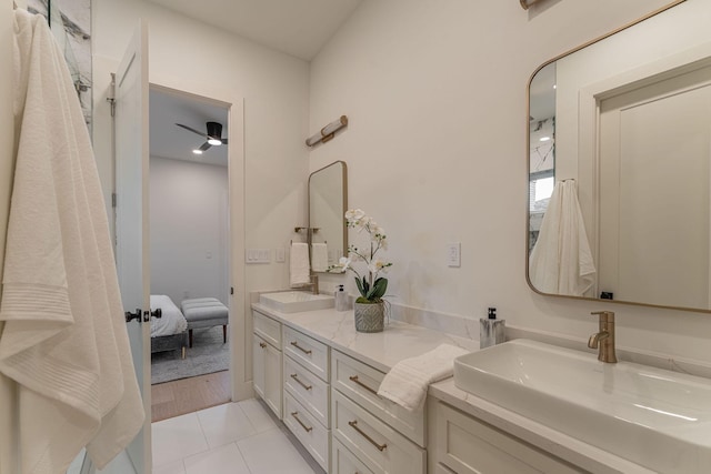 bathroom with ceiling fan, tile patterned flooring, and vanity