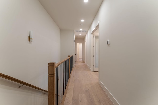 hall with light hardwood / wood-style floors