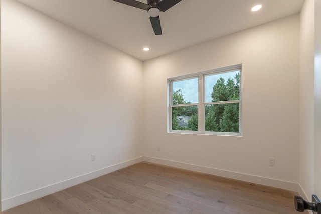 spare room with ceiling fan and light hardwood / wood-style floors