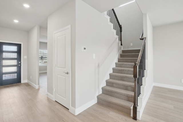 foyer with light hardwood / wood-style floors