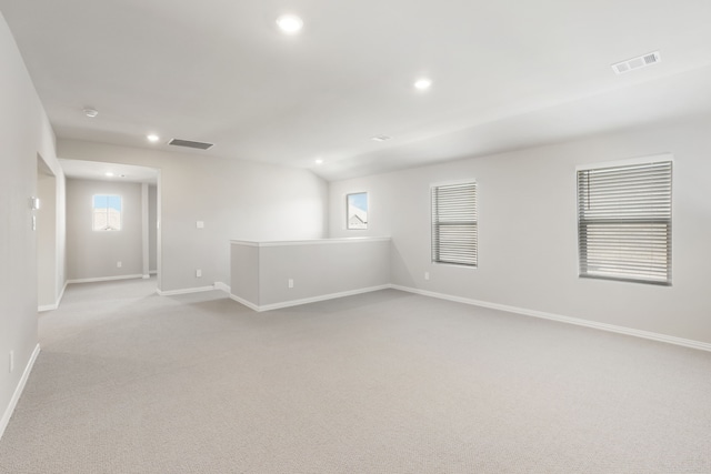 empty room with light colored carpet