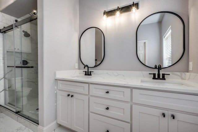 bathroom with vanity, toilet, and walk in shower