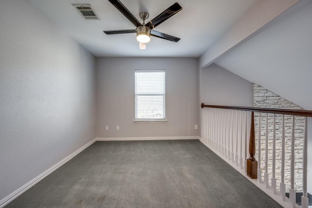 additional living space with vaulted ceiling with beams, ceiling fan, and carpet floors