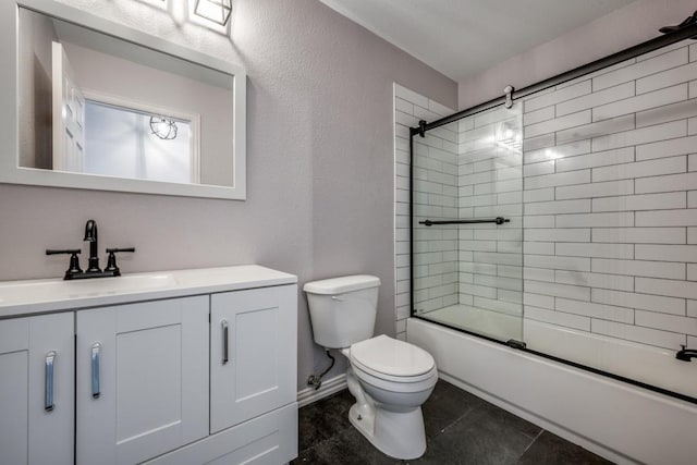 full bathroom featuring vanity, toilet, and shower / bath combination with glass door