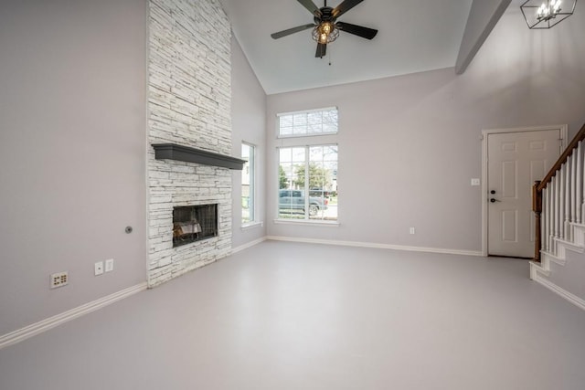 unfurnished living room featuring ceiling fan, a fireplace, and high vaulted ceiling